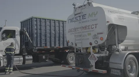 White and blue fuel tank trailer delivering gasoline, highlighting modern Fuel Delivery logistics